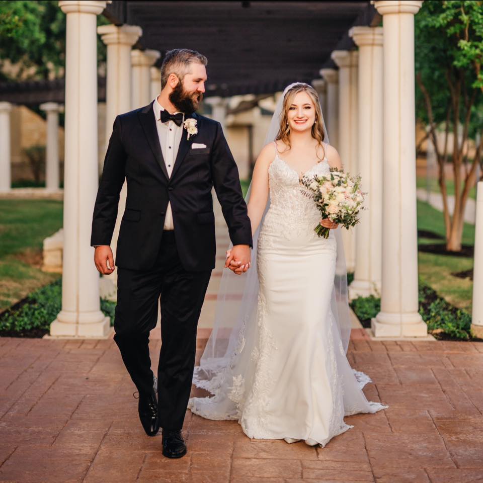 Bride and groom walking together with their Dallas Wedding DJ and Fort Worth Wedding DJ, Jeremiah Brinkley Music