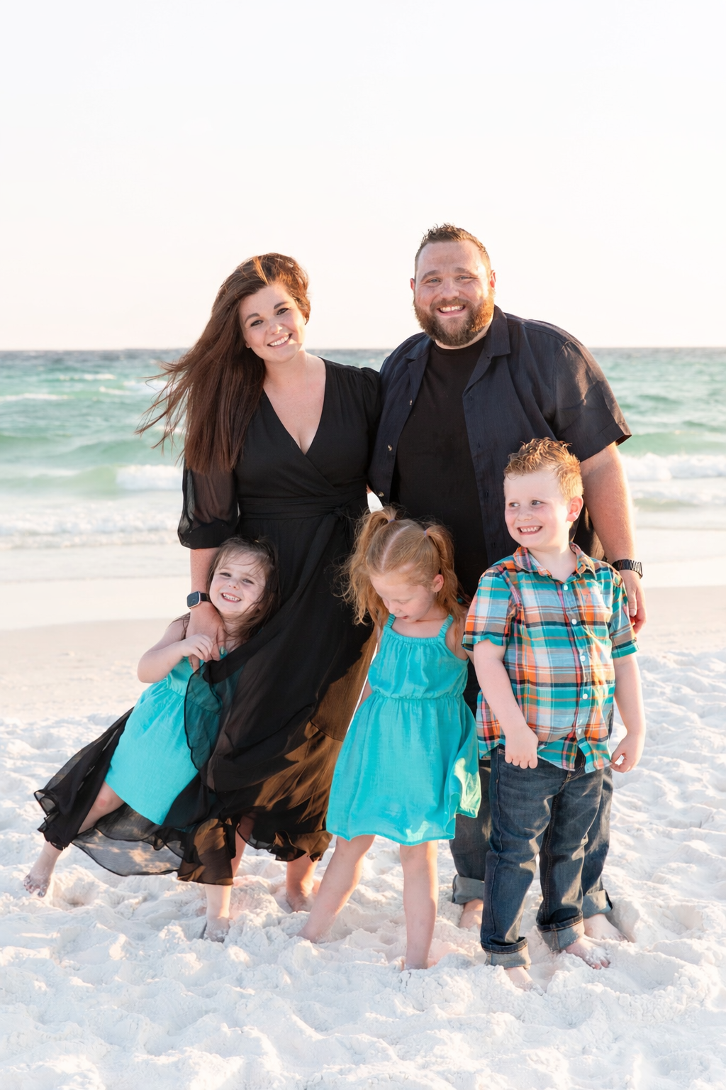 Jeremiah Brinkley Dallas Wedding DJ and Fort Worth Wedding DJ and his Family posing together on the beach