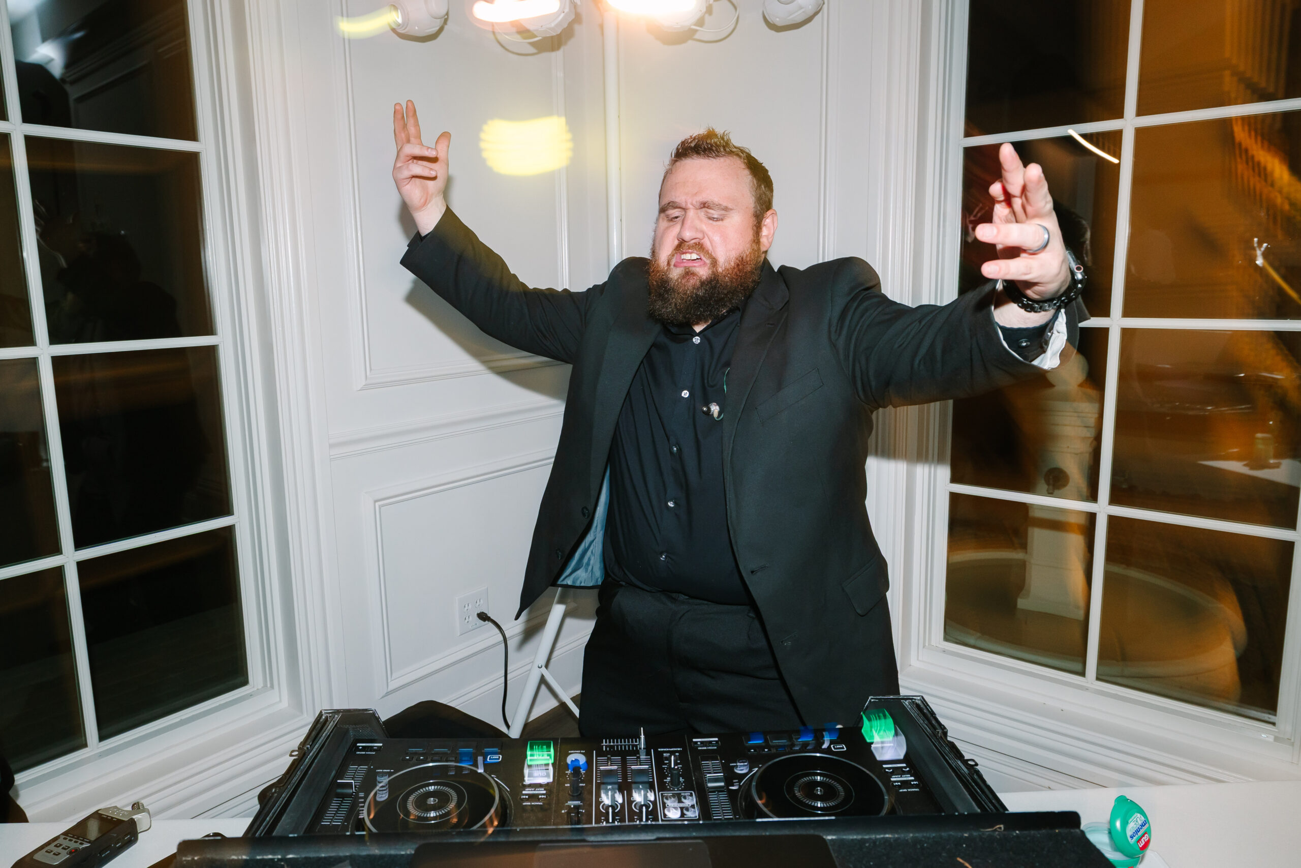 how to choose a wedding DJ Dallas Wedding DJ and Fort Worth Wedding DJ performing at a luxury wedding with elegant lighting and a full dance floor